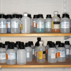 Bottles of hazardous chemicals on shelves