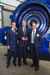 Group posing in front of pump