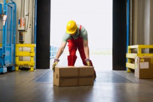 Warehouse worker lifting box